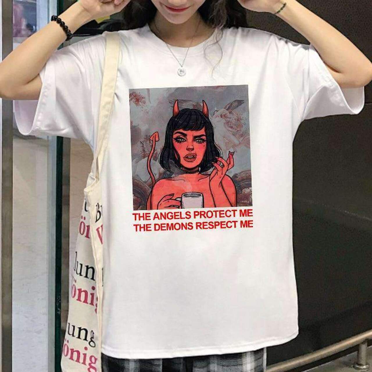 THE ANGELS PROTECT ME THE DEMONS RESPECT ME TEE